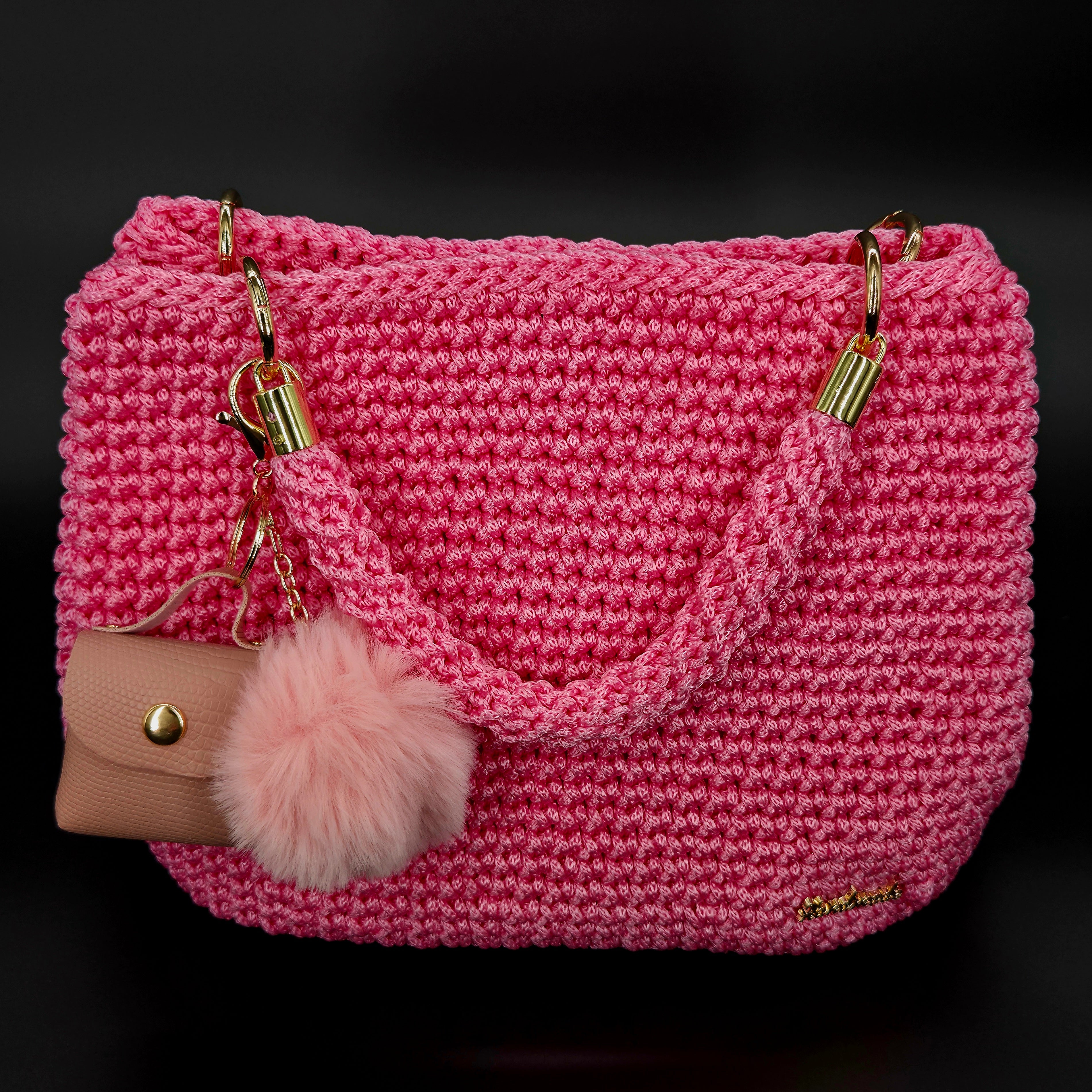 Bolso de mano crochet rosa con accesorios